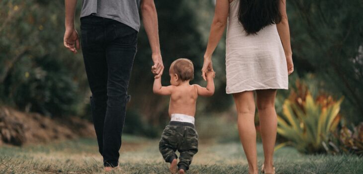 Why Is Marriage After Kids So Hard?Backs of dad, mum and toddler